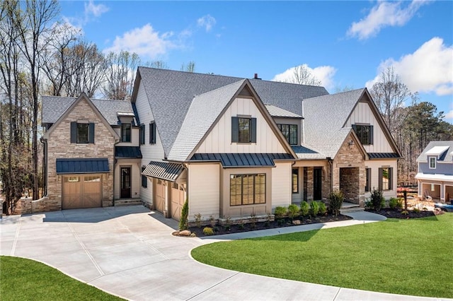 605 Claxton Ln, Milton, GA 30004 - modern farmhouse style home featuring a standing seam roof, driveway, a front lawn, an attached garage, and stone siding