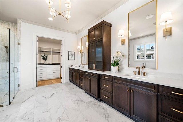 605 Claxton Ln, Milton, GA 30004 - full bath featuring crown molding, double vanity, a stall shower, a chandelier, and marble finish flooring