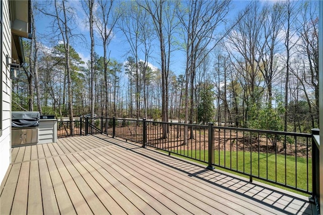605 Claxton Ln, Milton, GA 30004 - wooden terrace with area for grilling, view of scattered trees, and a yard