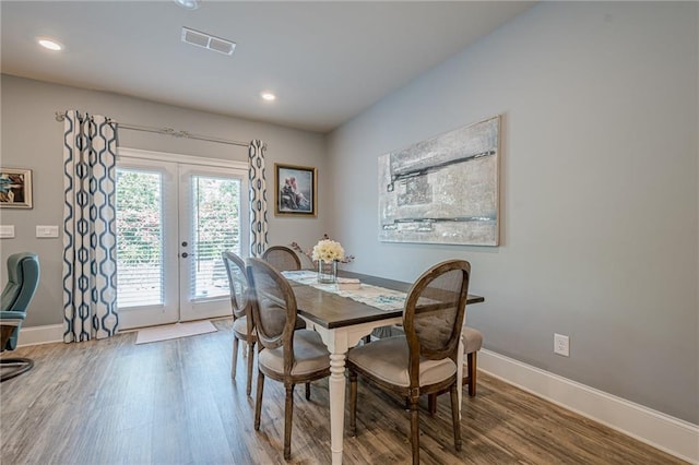 3715 Bridges Ct, Cumming, GA 30040 - dining area featuring french doors, wood finished floors, baseboards, and recessed lighting