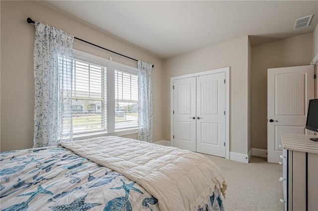 3715 Bridges Ct, Cumming, GA 30040 - bedroom featuring light colored carpet, a closet, and baseboards