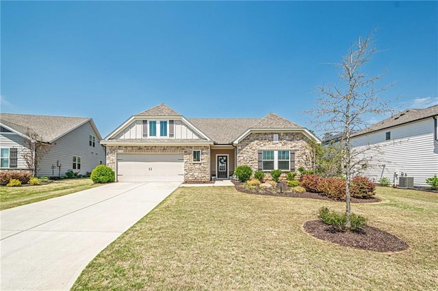 3715 Bridges Ct, Cumming, GA 30040 - craftsman-style home featuring stone siding, board and batten siding, concrete driveway, an attached garage, and a front lawn