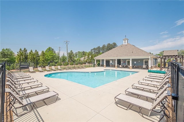 3715 Bridges Ct, Cumming, GA 30040 - community pool featuring a patio