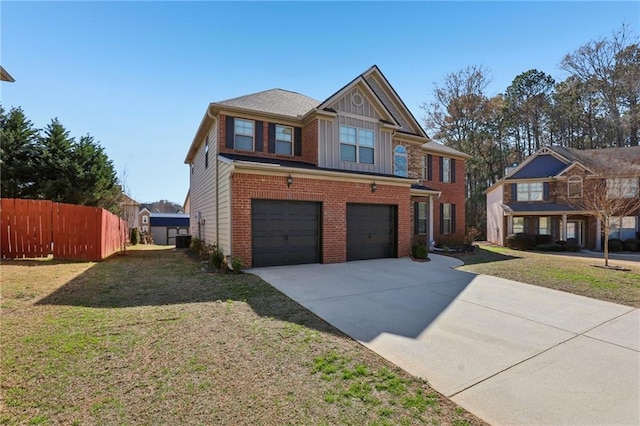 view of front of home with an attached garage, fence, concrete driveway, and brick siding