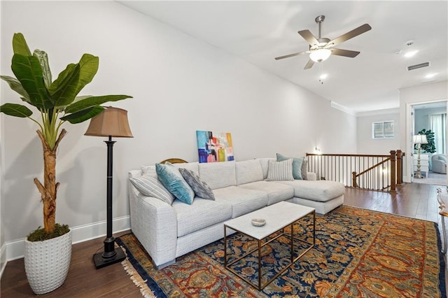 living room with lofted ceiling, dark wood-type flooring, and ceiling fan