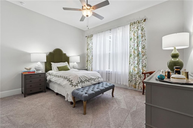 bedroom featuring ceiling fan and light colored carpet