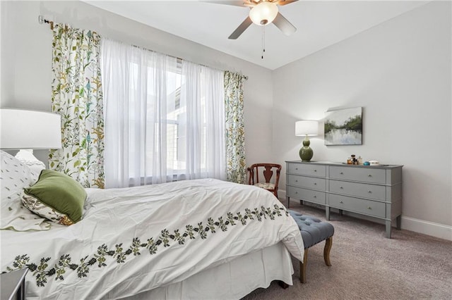 bedroom with ceiling fan and carpet