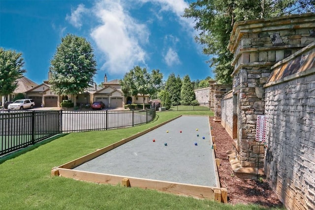 view of property's community with a lawn