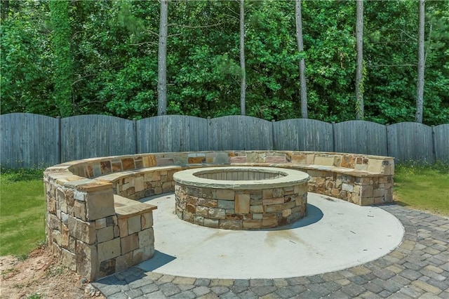 view of patio featuring an outdoor fire pit