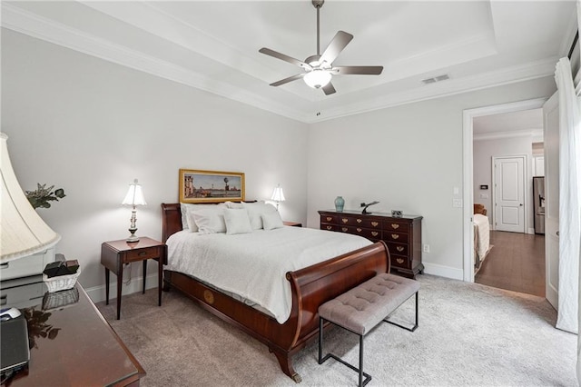 carpeted bedroom featuring stainless steel fridge, ornamental molding, a raised ceiling, and ceiling fan