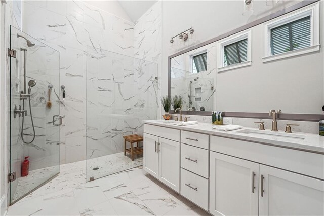 bathroom featuring an enclosed shower and vanity