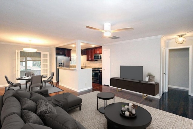 living room featuring crown molding and dark wood finished floors