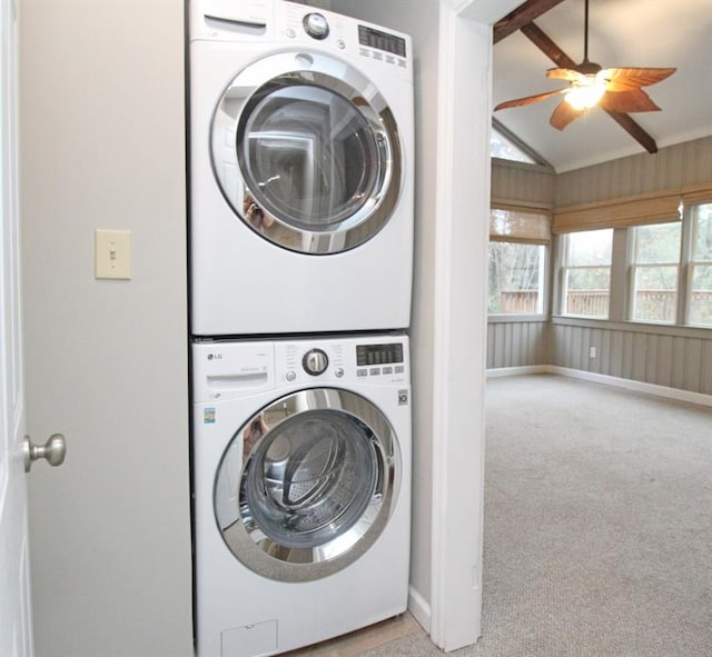 washroom with laundry area, baseboards, a ceiling fan, stacked washer and clothes dryer, and carpet floors