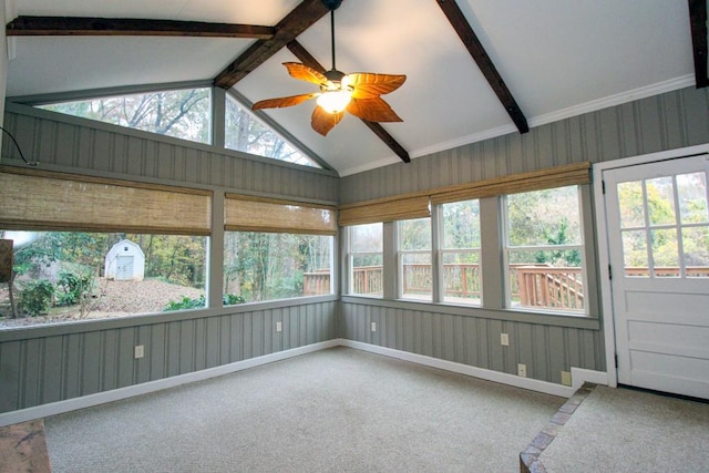 unfurnished sunroom featuring vaulted ceiling with beams and a ceiling fan