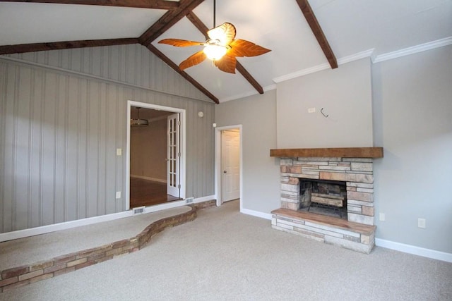 unfurnished living room with baseboards, visible vents, lofted ceiling with beams, carpet floors, and a fireplace