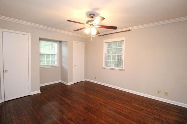 unfurnished bedroom with ceiling fan, crown molding, baseboards, and wood finished floors