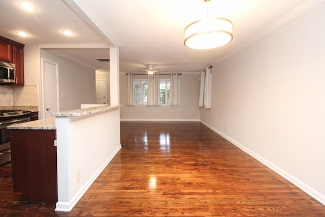 interior space featuring a ceiling fan, dark wood-style floors, appliances with stainless steel finishes, crown molding, and backsplash