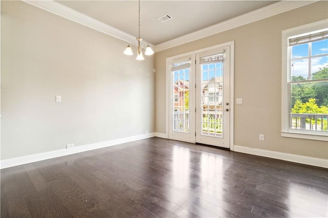 spare room with crown molding, a wealth of natural light, and dark wood-type flooring