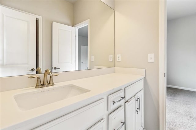 bathroom featuring vanity and baseboards