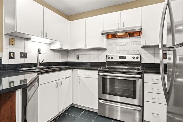 539 Mcgill Park Ave NE, Atlanta, GA 30312 - kitchen with appliances with stainless steel finishes, a sink, under cabinet range hood, tasteful backsplash, and white cabinetry