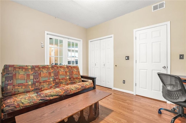 539 Mcgill Park Ave NE, Atlanta, GA 30312 - office area with wood finished floors, baseboards, french doors, and a textured ceiling