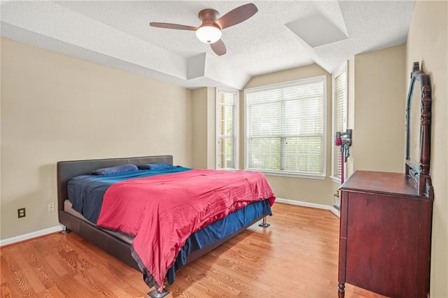 539 Mcgill Park Ave NE, Atlanta, GA 30312 - bedroom with a textured ceiling, wood finished floors, baseboards, vaulted ceiling, and ceiling fan
