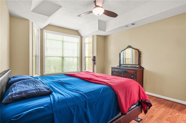 539 Mcgill Park Ave NE, Atlanta, GA 30312 - bedroom with a textured ceiling, wood finished floors, ceiling fan, and baseboards