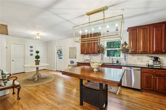 1600 Belle Isle Cir NE, Atlanta, GA 30329 - kitchen with dishwasher, dark countertops, decorative backsplash, light wood finished floors, and a chandelier