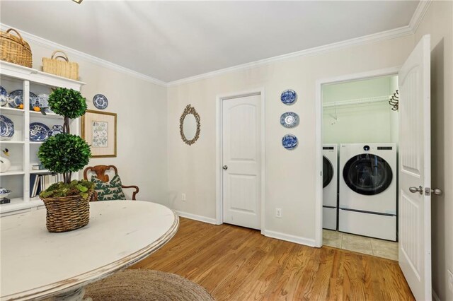 1600 Belle Isle Cir NE, Atlanta, GA 30329 - dining area with crown molding, light wood-style floors, and washing machine and clothes dryer