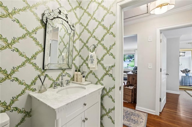 1600 Belle Isle Cir NE, Atlanta, GA 30329 - half bath with wood finished floors, vanity, crown molding, and plenty of natural light
