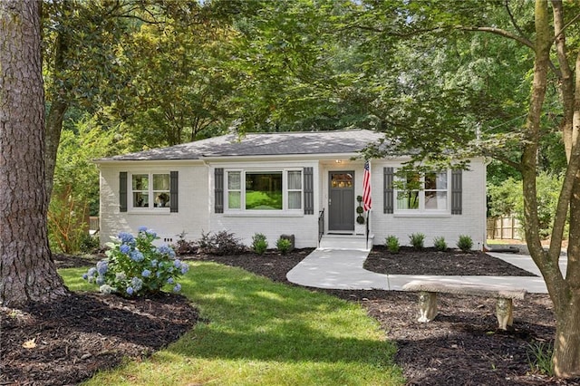 1600 Belle Isle Cir NE, Atlanta, GA 30329 - ranch-style home featuring brick siding, a front yard, and roof with shingles