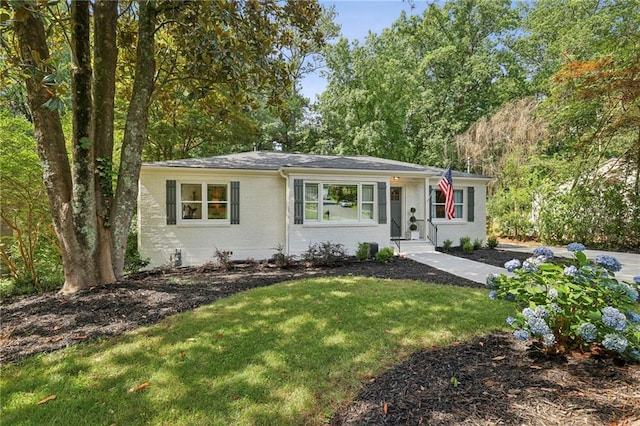 1600 Belle Isle Cir NE, Atlanta, GA 30329 - ranch-style home featuring brick siding and a front lawn