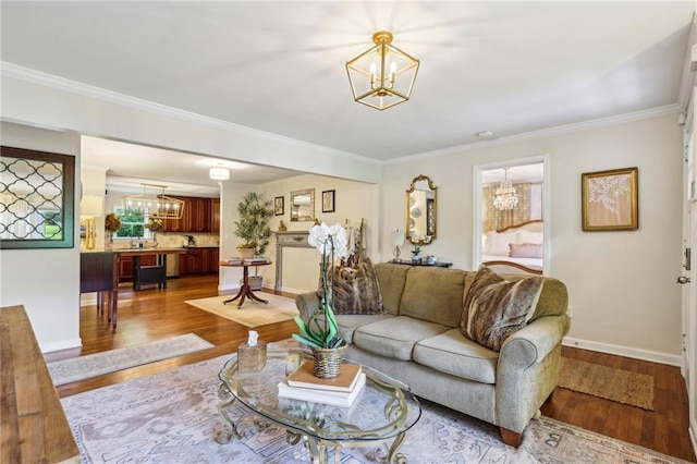 1600 Belle Isle Cir NE, Atlanta, GA 30329 - living room with a chandelier, dark wood-style flooring, ornamental molding, and plenty of natural light