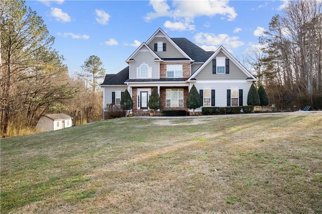 craftsman-style house with a front yard and a storage unit