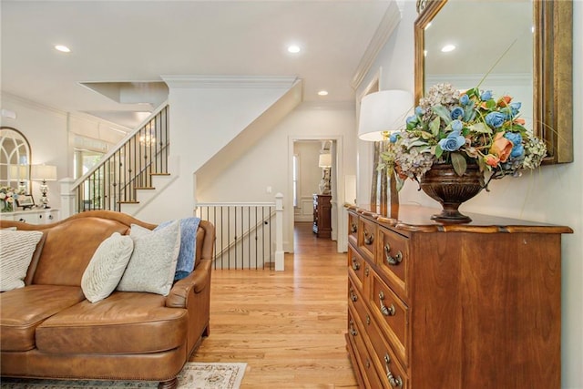 interior space featuring light hardwood / wood-style floors and crown molding