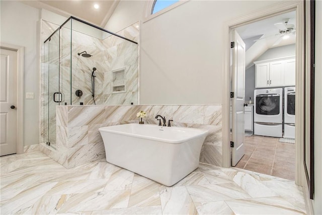 bathroom featuring vanity, plus walk in shower, and vaulted ceiling