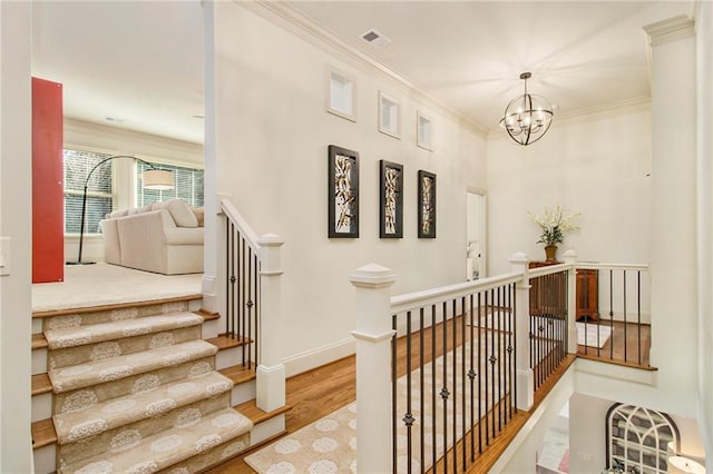 living room featuring light colored carpet, built in features, ceiling fan, and ornamental molding