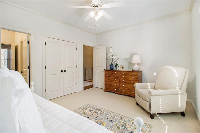 carpeted living room with ceiling fan, a healthy amount of sunlight, and ornamental molding