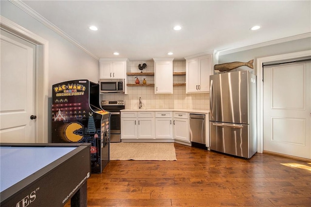 dining area with ceiling fan, french doors, dark hardwood / wood-style floors, and ornamental molding