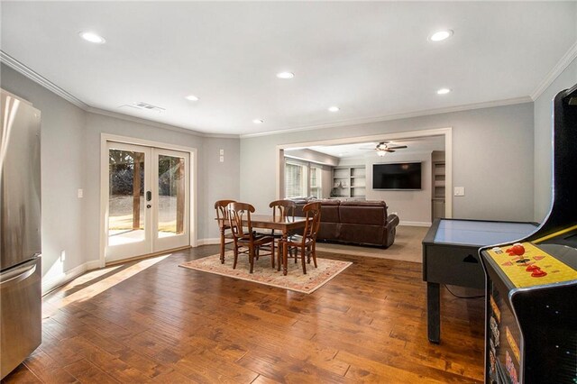 carpeted bedroom with ceiling fan and ornamental molding