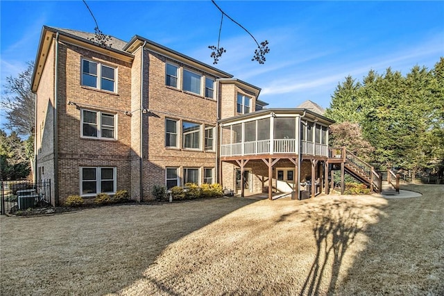 view of yard featuring a patio area and a sunroom