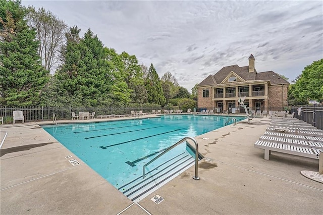 view of swimming pool featuring a patio area