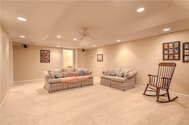 living area featuring recessed lighting, light carpet, and baseboards