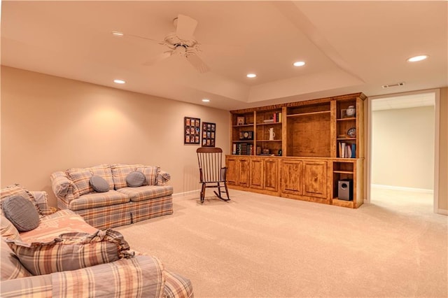 living area with recessed lighting, visible vents, and baseboards