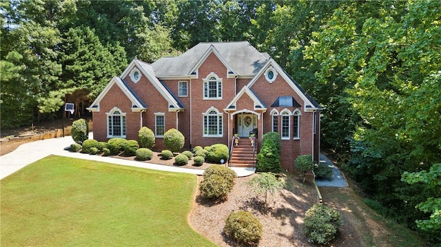 2287 Lake Ridge Ter, Lawrenceville, GA 30043 - view of front of house with brick siding and a front lawn