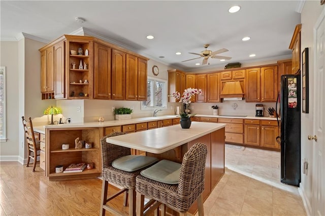2287 Lake Ridge Ter, Lawrenceville, GA 30043 - kitchen with open shelves, black appliances, custom exhaust hood, crown molding, and light countertops