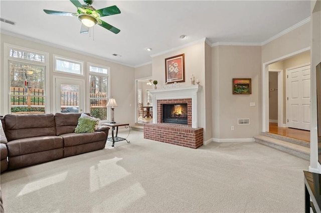 2287 Lake Ridge Ter, Lawrenceville, GA 30043 - living room with ornamental molding, ceiling fan, carpet, and a fireplace