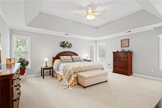 2287 Lake Ridge Ter, Lawrenceville, GA 30043 - bedroom featuring a tray ceiling, light colored carpet, ornamental molding, and a ceiling fan