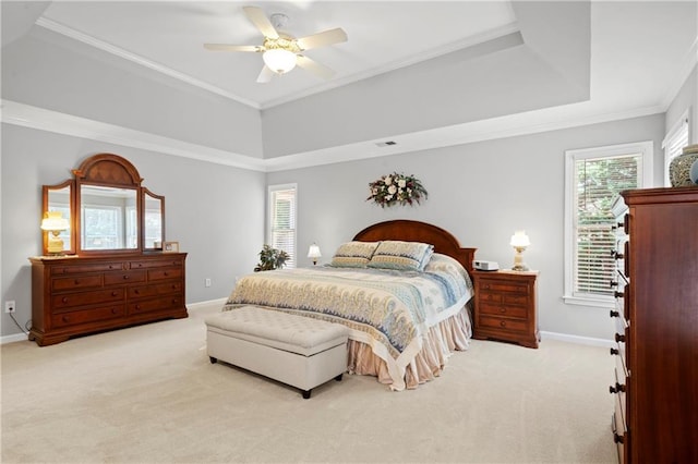 2287 Lake Ridge Ter, Lawrenceville, GA 30043 - carpeted bedroom with multiple windows, a tray ceiling, ornamental molding, and a ceiling fan