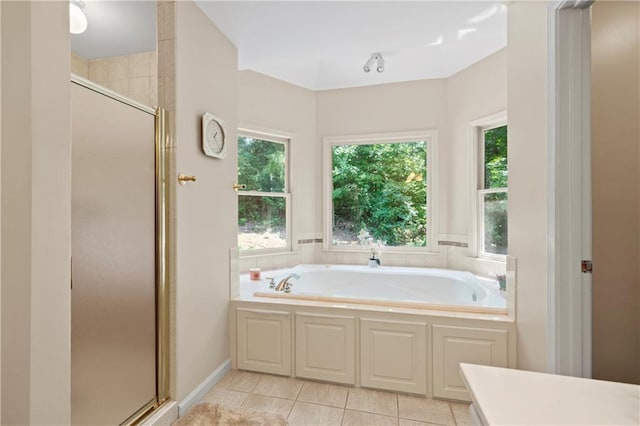 2287 Lake Ridge Ter, Lawrenceville, GA 30043 - bathroom featuring a garden tub, a stall shower, and tile patterned flooring